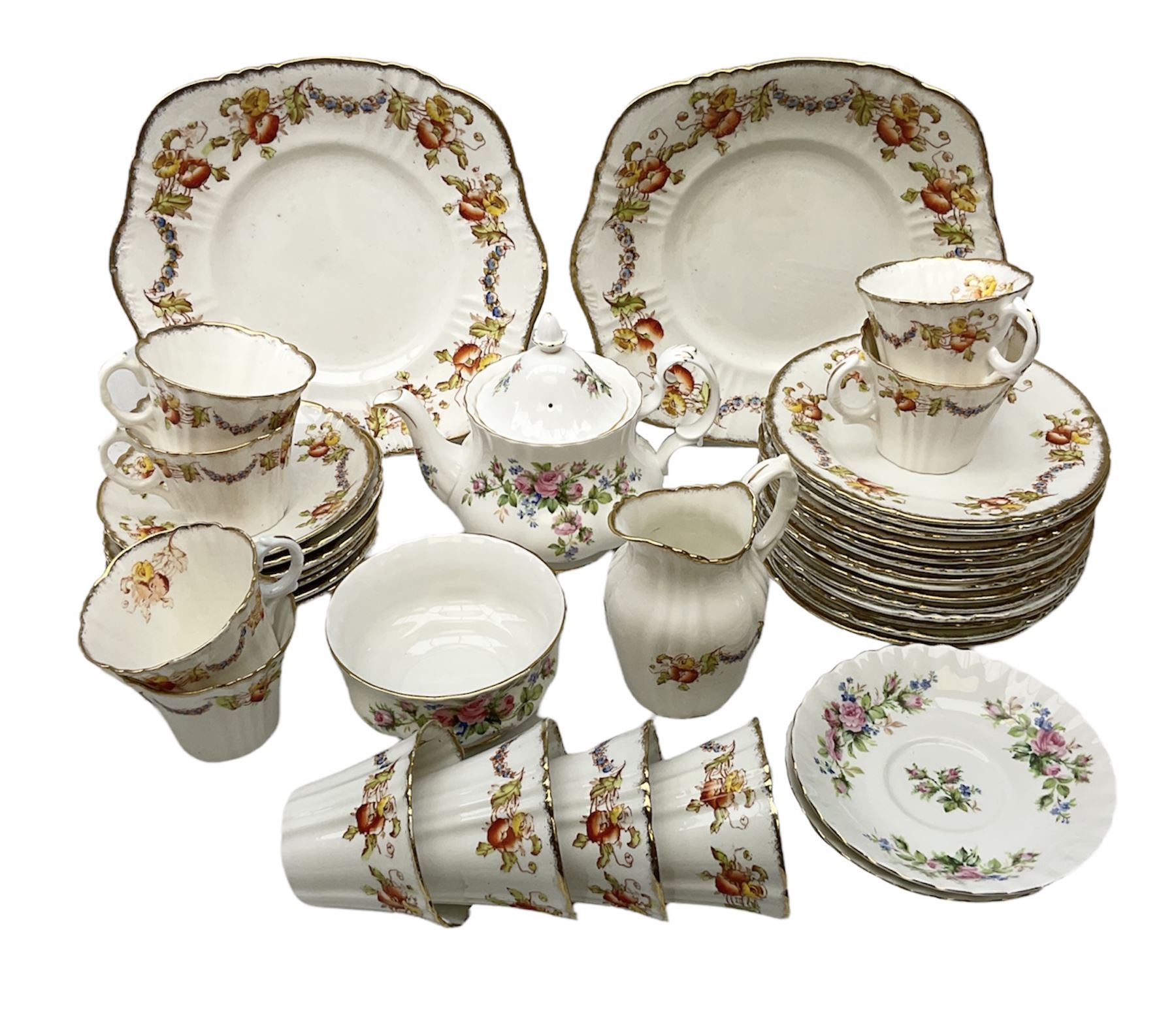Quantity of Royal Albert tea wares to include 'Moss Rose' teapot, sucrier and saucers, together with teacups, saucers, side plates, jug etc decorated with orange, yellow and blue floral sprays with gilding upon plain ground, all stamped Royal Albert beneath
