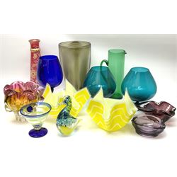 A group of coloured glassware, to include Art Glass examples, including a tapering grey glass vase, H32cm, a Wedgwood paperweight modelled as a bird, a Victorian green glass jug, H28cm, etc. 