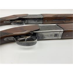 Two Russian Baikal 12-bore over-and-under double barrel boxlock non-ejector sporting guns; one with 68.5cm barrels, walnut stock with chequered pistol grip and fore-end and thumb safety, serial no.520545, L111cm overall; the other with 72.5cm barrels, walnut stock with chequered pistol grip and fore-end and thumb safety, serial no.012448, L114.5cm overall (2) SHOTGUN CERTIFICATE REQUIRED