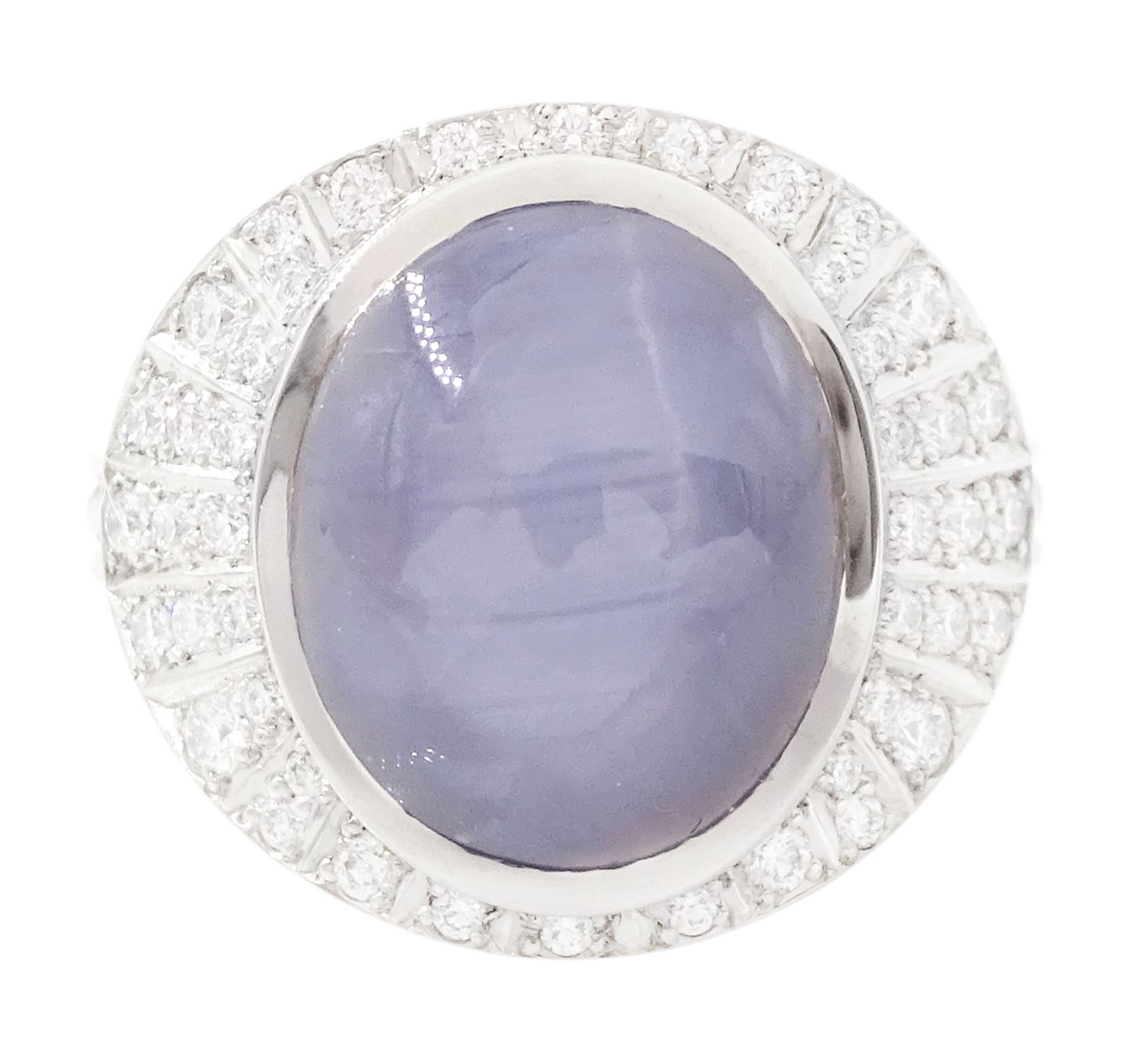 Platinum star sapphire and diamond ring by Scarab London, single cabochon cut sapphire of approx 8.17 carat, with sunburst design surround set with round brilliant cut diamonds, to a plaited design shank, London 2024, total diamond weight approx 0.50 carat, with Alan Poultney Gems report