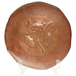 Newlyn Arts and Crafts beaten copper circular tray with raised rim, the centre with raised...