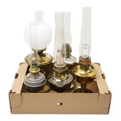 Brass table oil lamp of circular form, two Aladdin 23 lamps, Famos lamp and one other