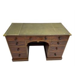 Victorian mahogany twin pedestal desk, green leather top with brass corner brackets, fitted with nine drawers, on plinth base