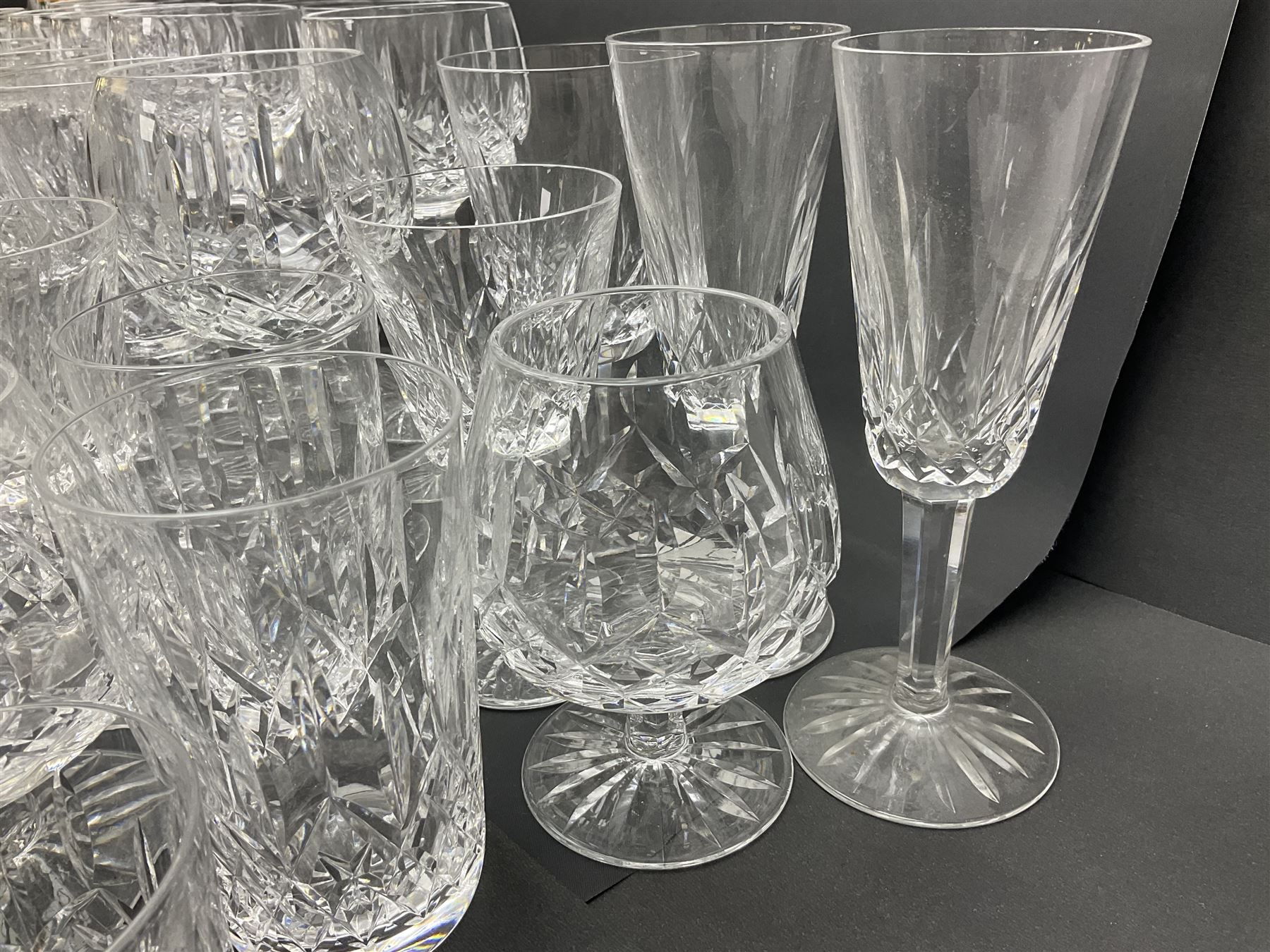Set of Waterford Crystal Lismore pattern drinking glasses for six people, including hock glasses, goblets, champagne flutes,  sherry glasses, liqueur glasses, hi ball glasses, whisky glasses, brandy balloons, etc, all with etched maker's mark beneath  (62)