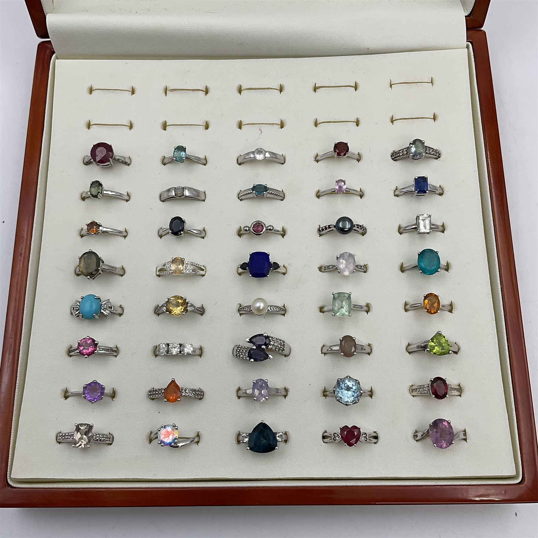 Silver Collector Rings Forty silver stone-set rings, including ruby, topaz, pearl, labradorite ...