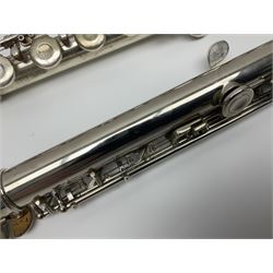 Boosey & Hawkes London Regent three-piece flute, serial no.345447; in B&H Bandhite hard carrying case; and Deg Music Company Inc. USA Claudel Model three-piece flute, serial no.491718, in hard carrying case (2)