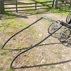 Victorian Bath Chair / Invalid Carriage Converted for Horse Drawn Use

A Victorian bath chair or invalid carriage, later converted for horse drawn use, with black painted bodywork, blue side panels, folding black leather hood and upholstered single passenger seat. The carriage is fitted with large rear wire spoked wheels, smaller front steering wheels, long shafts, footwell and curved body sides, consistent with a late nineteenth century invalid carriage or bath chair form adapted for pony or light horse use.

Features

Bath chair or invalid carriage form
Later converted for horse drawn use
Folding black leather hood
Single upholstered passenger seat
Deep footwell
Black painted body with blue side panels
Large rear wire spoked wheels
Smaller front steering wheels
Long shafts
Lightweight carriage frame

Dimensions:
Overall length: 380 cm
Body length: 204 cm
Width: 88 cm
Height: 178 cm

Wheel Diameters:
Front wheels: 47 cm
Rear wheels: 88 cm

Seating:
Driver: 1
Passenger: None