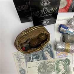Coins and banknotes including eight United states of America silver dollars, small number of Great British pre 1947 silver threepence pieces,  pre-decimal coins including pennies, Bank of England Hollom five pounds 'H49', Page five pounds '03T' etc