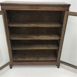  Victorian walnut bookcase, two glazed doors enclosing three adjustable shelves, cabriole feet, W107cm, H132cm, D28cm  