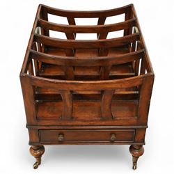 Late 20th century large mahogany canterbury, of rectangular form with four divided curved upper racks, single frieze drawer with brass knob handles, raised on turned legs with brass castors