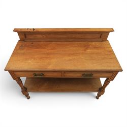 Edwardian oak serving table, raised panelled back over moulded rectangular top, fitted with two frieze drawers with brass drop handles, fluted front uprights, on turned supports united by potboard undertier