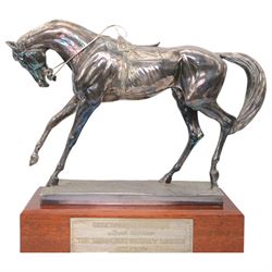 'The Freestone Stanley Lincoln Handicap Trophy, Doncaster Racecourse March 22nd 2003' - Silver filled model of a racehorse H32cm x W42cm on a mahogany plinth with silver plaque Sheffield 2003 Maker Laurence R Watson & Co.; together with a framed photograph of Guy Reed receiving the trophy (2)