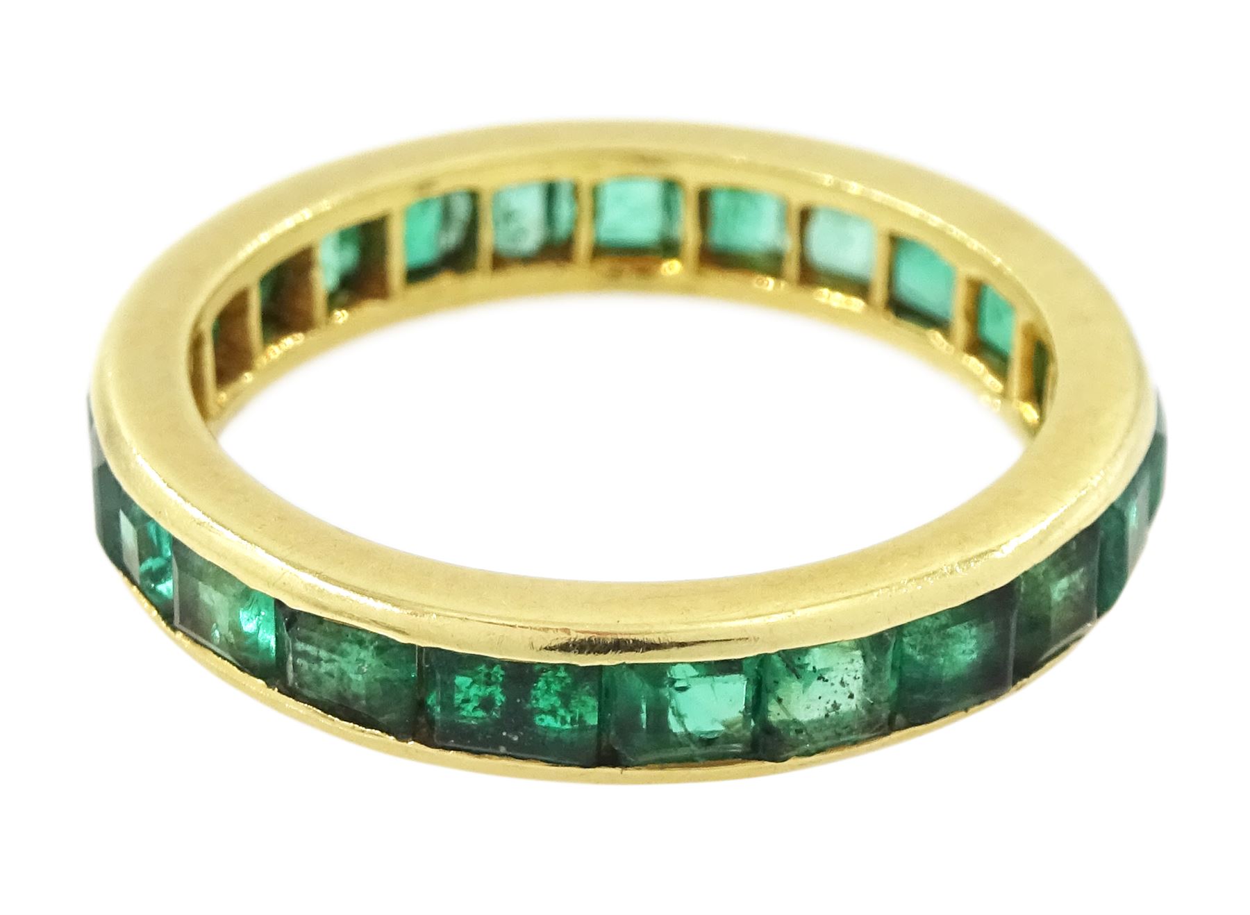 18ct gold emerald full eternity ring, channel set with calibre cut emeralds