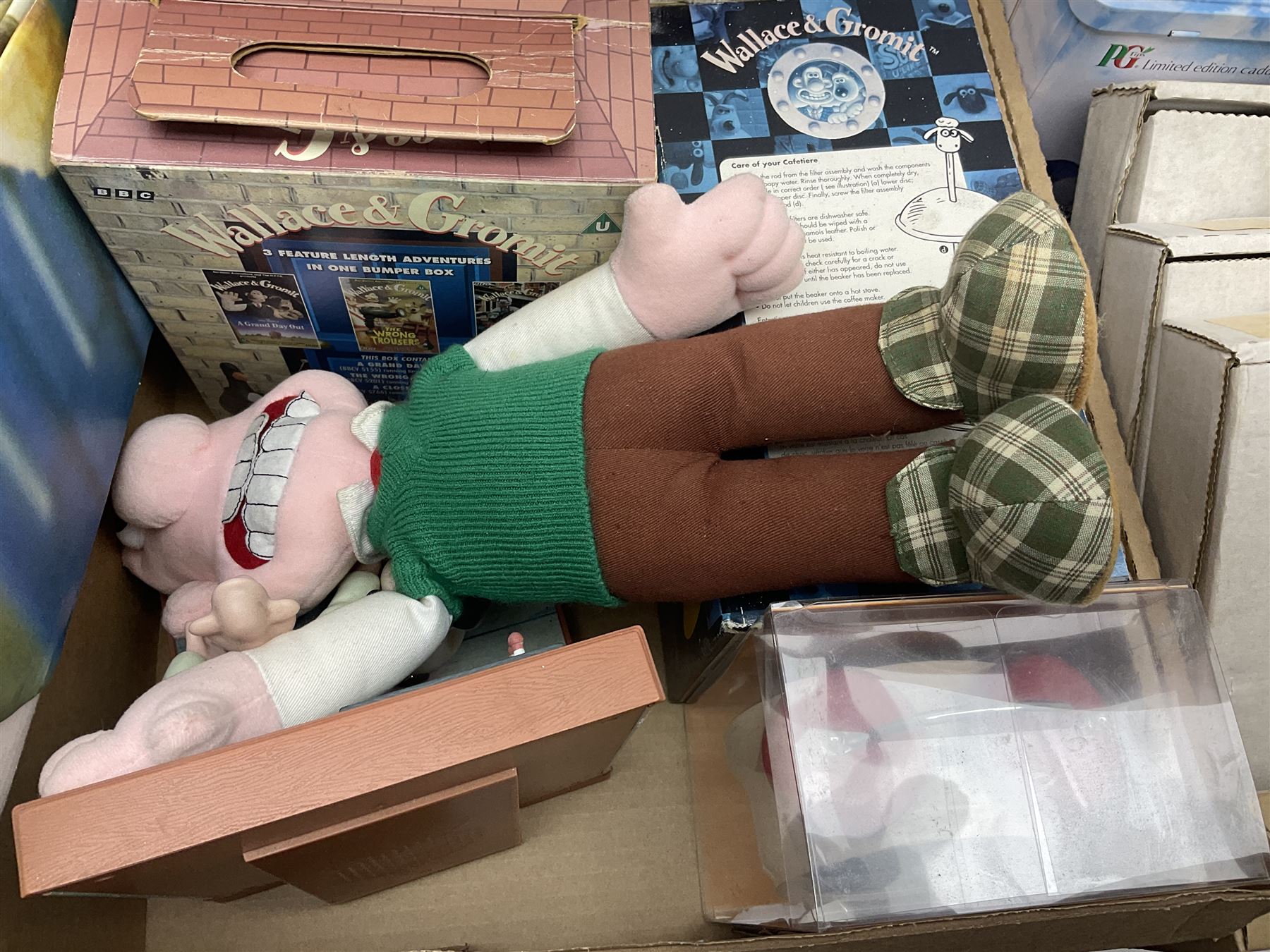 Wallace and Gromit and Shaun the Sheep collectables, including alarm clocks, plates, cafetiere, soft toys, etc, in two boxes