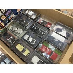 Fabbri James Bond Collection - over one hundred and ten die-cast models in perspex display cases as issued periodically; and a quantity of associated magazines and trading cards, in five boxes