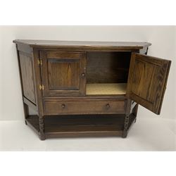 Mid 20th century oak shaped front side cabinet fitted with two cupboards and single drawer 