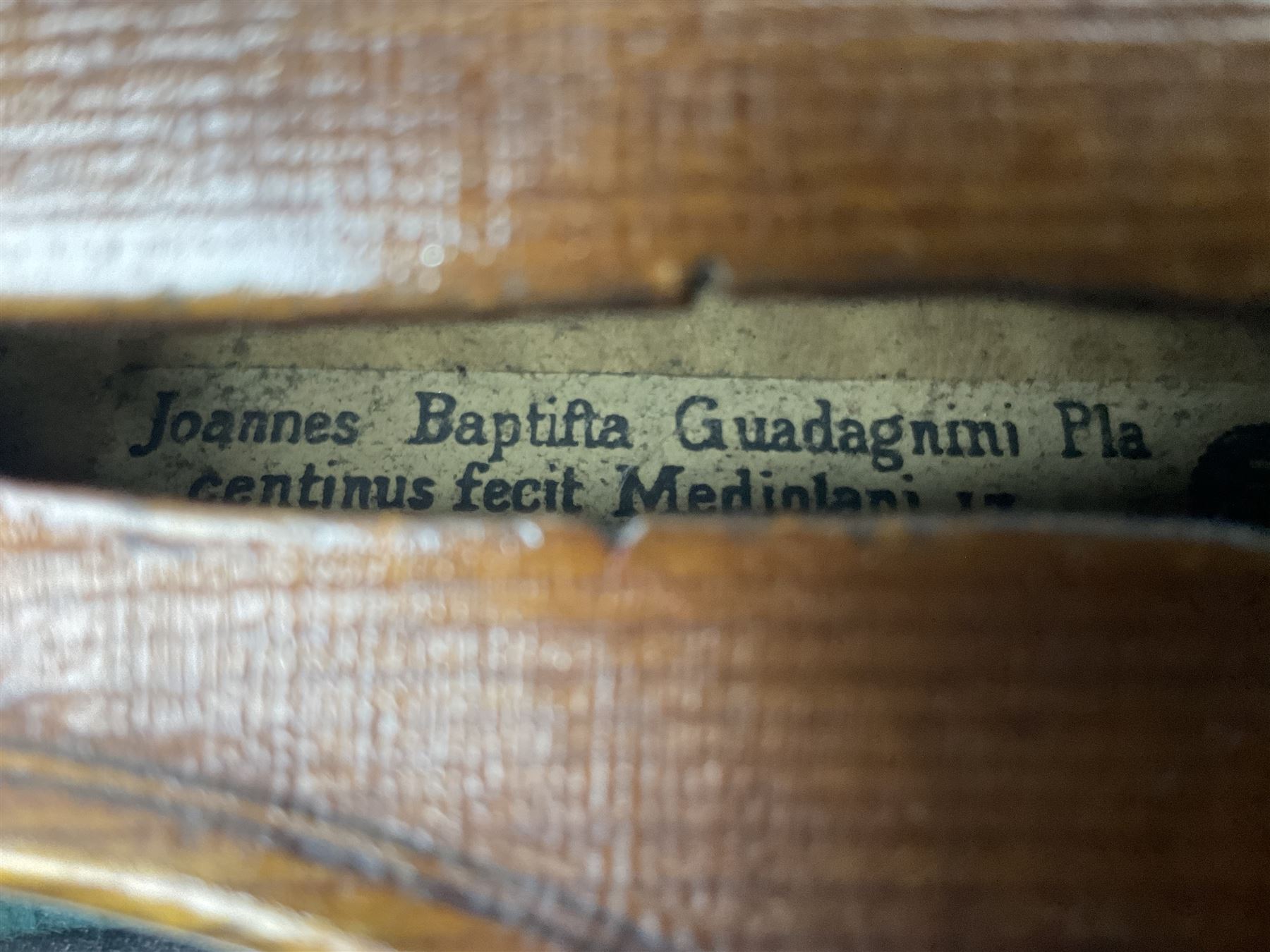 French violin c1900 labelled Guadagnini with 35.5cm two-piece maple back and ribs and spruce top, labelled 'Joannes Baptista Guadagnini Pla Centinus Fecit Mediolani 17**' L59cm overall; in hard carrying case