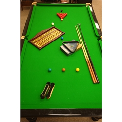  Late 20th century slate bed snooker table, on ebonised base, turned baluster supports, green baize bed, with accessories including ball set, cues, scoreboard and brushes, W160cm, H86cm, L293cm  