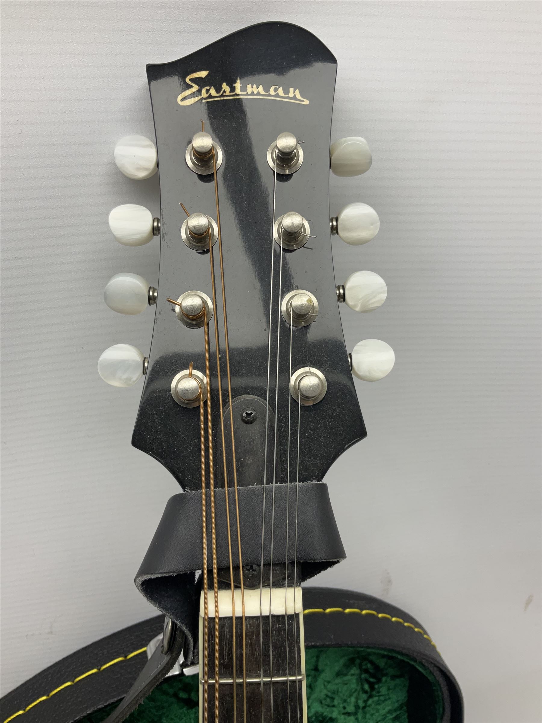 Eastman eight-string mandolin model MD504, serial no.140435406, L66cm; in TGI hard carrying case; together with case of instructional CDs