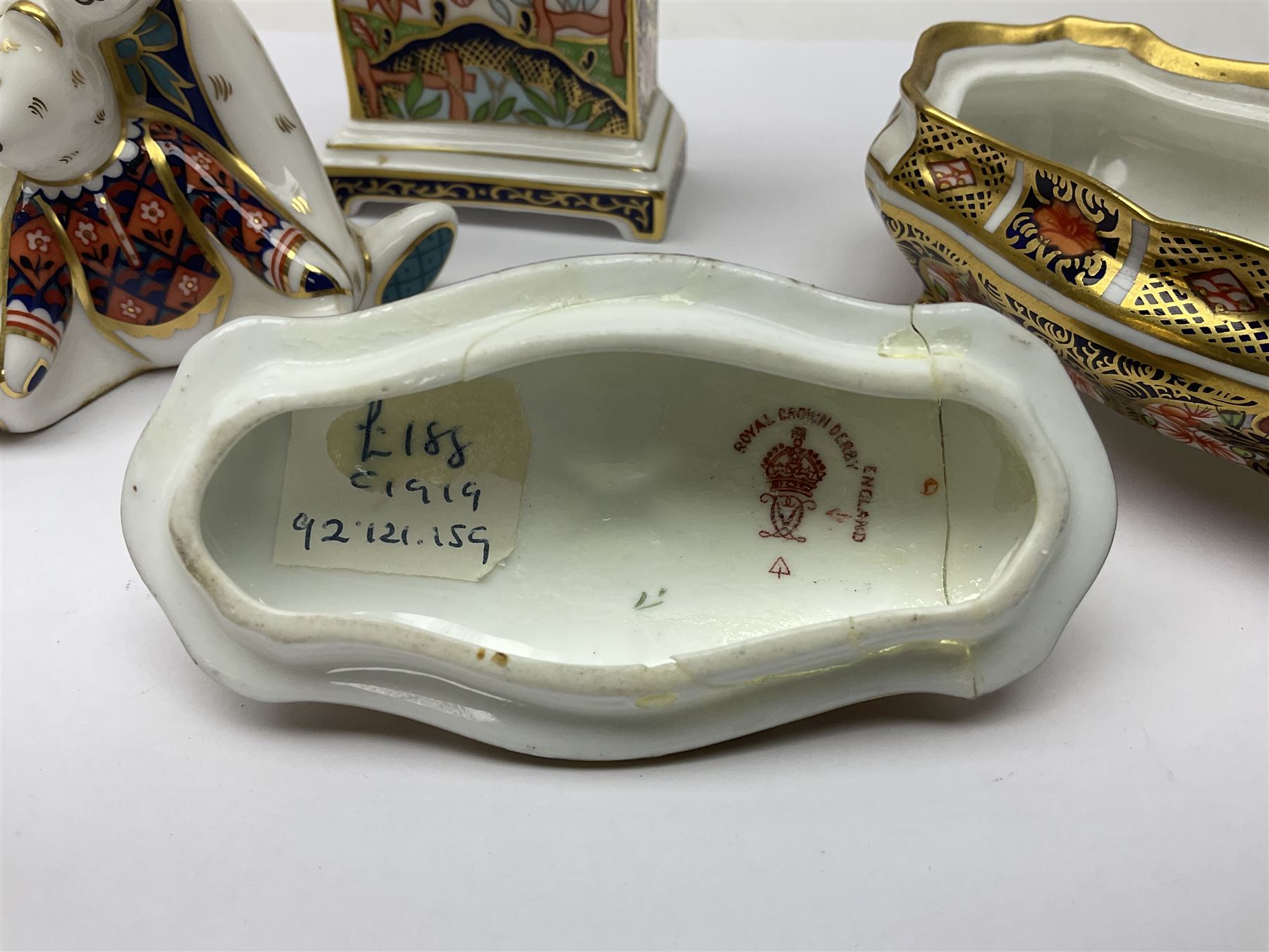 Royal Crown Derby Haiku pattern miniature clock, together with 1128 Imari pattern trinket box with cover and teddy bear figure, all with printed marks beneath   