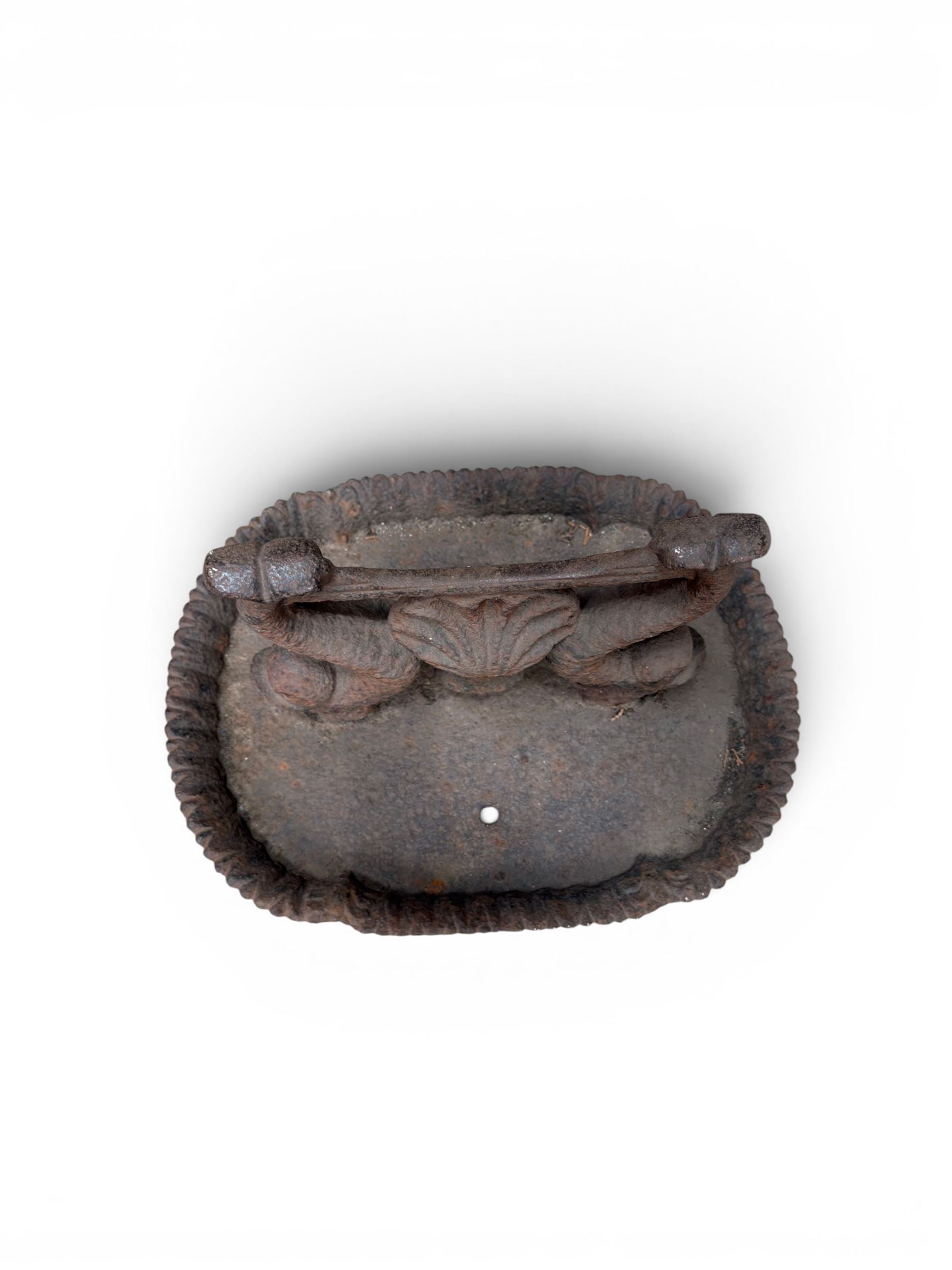 Victorian cast iron boot scraper, supported by two dolphins with central shell motif