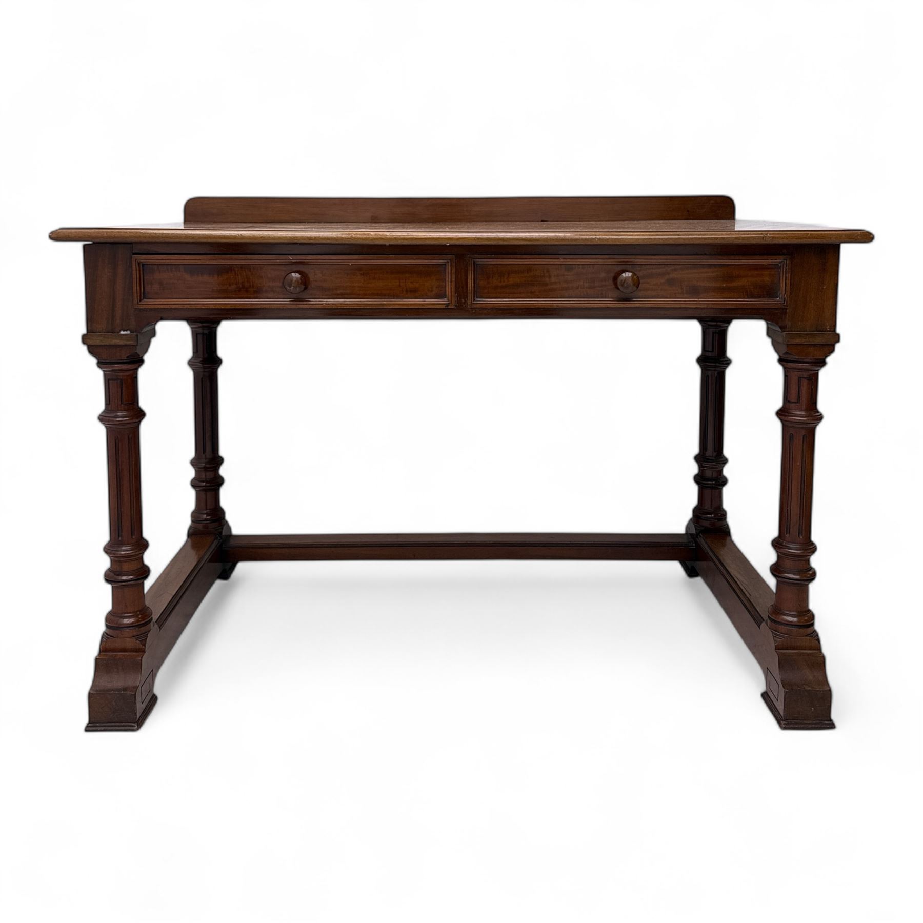 Late Victorian mahogany side table in the style of Gillows of Lancaster, mahogany rectangular top above two frieze drawers, the top edge of the right drawer stamped 'Gillow' and 'L486' with knob handles supported on turned stop and fluted legs with stretcher base on recessed castors

Provenance: The Davies-Cooke Collection from Gwysaney Hall, North Wales  