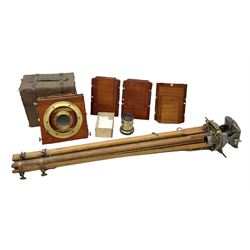Thornton Pickard folding plate camera in mahogany and lacquered brass, no.529946 and no.529947, field model with canvas wrapped box, three mahogany photographic plates, 'Busch's Portrait Aplanat No4 Foc.14inc' lens and a wooden tripod