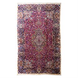 Large North East Persian Meshed hand-knotted carpet with signature, raspberry red field wi...