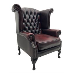 Thomas Lloyd - Georgian style wing back armchair, upholstered in buttoned oxblood leather