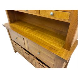 Manor Oak - light oak dresser and rack, fitted with two shelves with three drawers, two deep drawers and pot baked base with basket storage