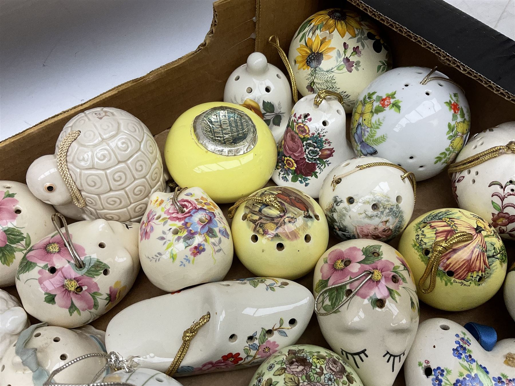Large collection of ceramic pomanders, to include examples modelled as animals, floral examples etc