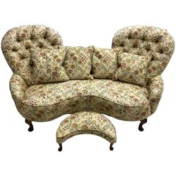 Victorian design hardwood-framed double back settee, upholstered in buttoned floral pattern fabric, curved back over serpentine seat, on cabriole feet, with matching scatter cushions (W182cm, H94cm, D86cm); together with crescent-shaped footstool with cabriole feet (W55cm)