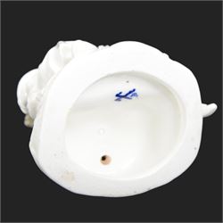 Pair of 19th century Meissen style Blanc de Chine figural candlesticks, each depicting children gathering flowers, with spurious mark beneath, H21cm