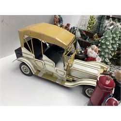 Collection of miniature dolls house Christmas figures and decorations, to include composite figure of family building snowman, postbox, Christmas trees and presents, together with a miniature metal car, etc