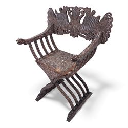 Anglo-Indian bone inlaid hardwood Savonarola chair, the pierced back finely carved with opposing peacocks amongst scrolling foliage, the seat, arms, and X-frame supports. This item has been registered for sale under section 10 of the APHA Ivory Act Reference QWLLGKZM