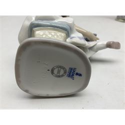 Three Lladro figures, comprising Garden Classic, signed no 7617, Summer Stroll no 7611 and Best Friend no 7620, all with original boxes, largest example H24cm 