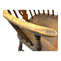 19th century provincial elm and beech Windsor armchair, shaped cresting rail over stick back with pierced and shaped splat, the dished seat on turned supports united by turned stretchers 