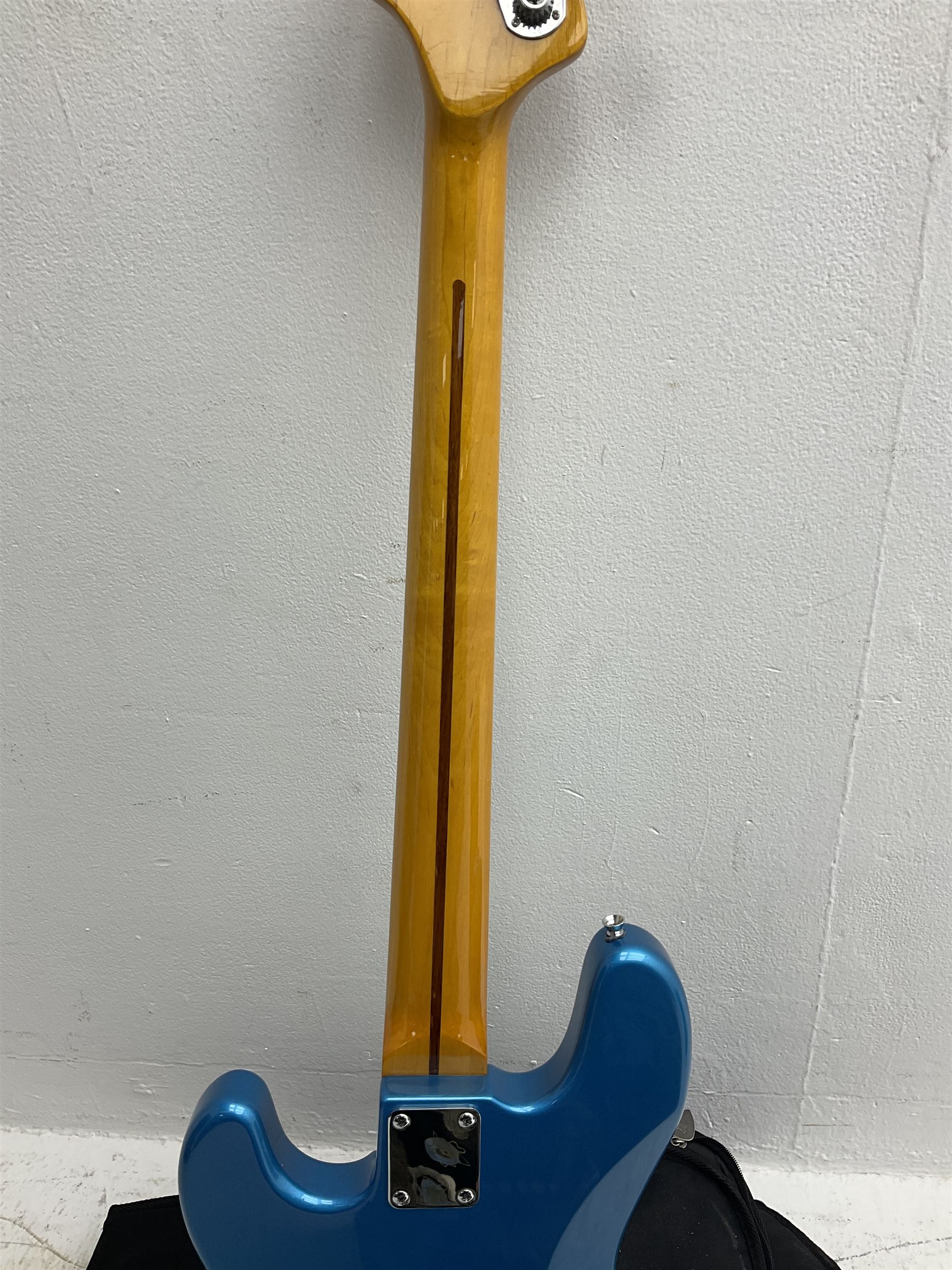 Richwood electric bass guitar in blue, cream and natural finish L117cm; in Fender soft carrying case; together with Behringer Thunderbird Bx108 amplifier date code 0 4 11.