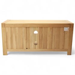 Contemporary solid oak television stand, rectangular top over an open central section with adjustable shelf, flanked by cupboard doors with vertical recessed panel fronts and brushed steel handles, on block feet