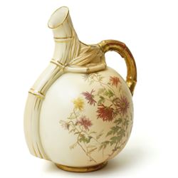 Victorian Royal Worcester ornamental ewer with gilded handle painted with floral sprays on a blush ivory ground H22cm