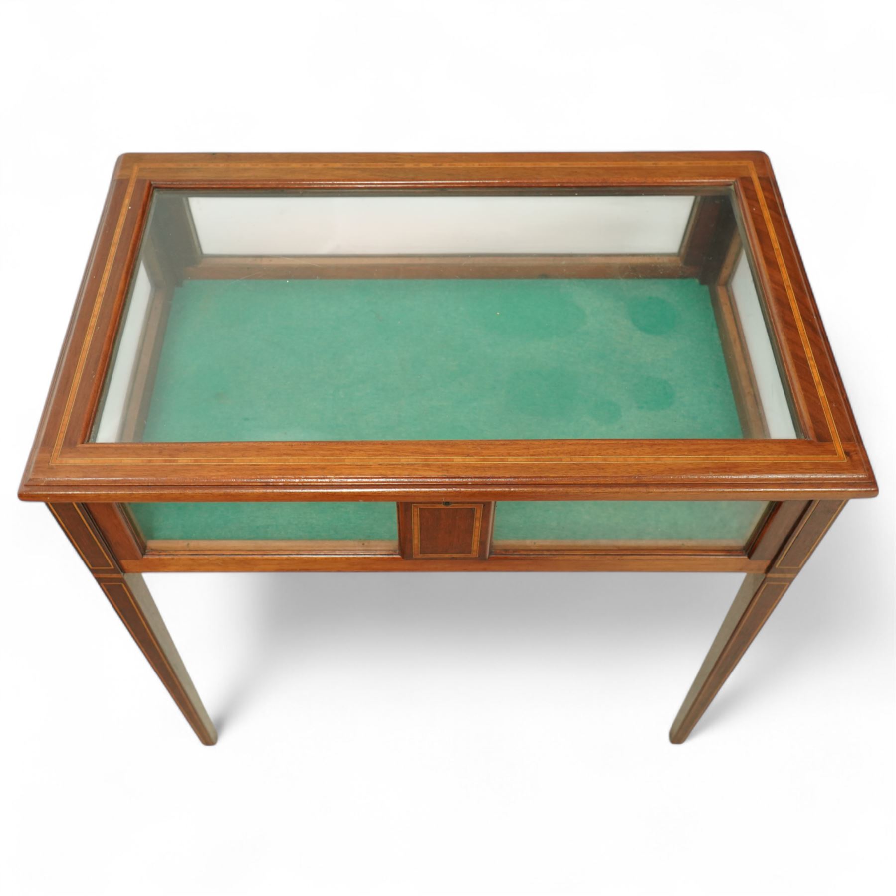 Edwardian satinwood and inlaid bijouterie table, rectangular hinged glazed top above a baize-lined interior, frieze with panelled inlay detail, raised on square tapered legs with boxwood and ebony stringing