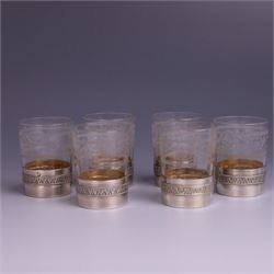 French silver mounted glass decanter and shot glass set, the decanter with silver covered stopper, removable silver collar, and etched decoration to glass body, the six silver mounted glasses each with etched decoration, silver stamped with Minerva's head, decanter H 21cm