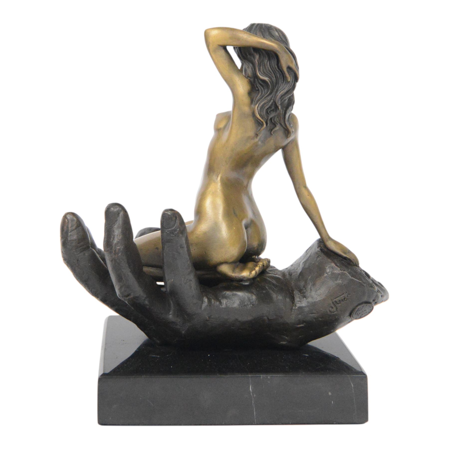 Nude In Hand bronze sculpture modeled as a female nude seated in a hand upon a marble base, signed June H24cm   