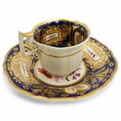 19th century teacup and saucer, possibly Coalport, decorated with panels of flowers on a cobalt blue ground with gilt decoration; together with two other teacup and saucer pairs, one with hand painted landscape decoration 