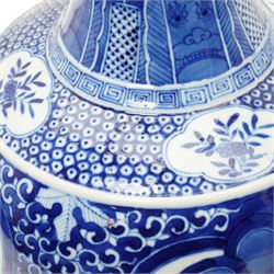 Late Qing Dynasty bottle vase decorated in blue and white with dragons and pearls, stylised leaves and flowers with key pattern foot H40cm 