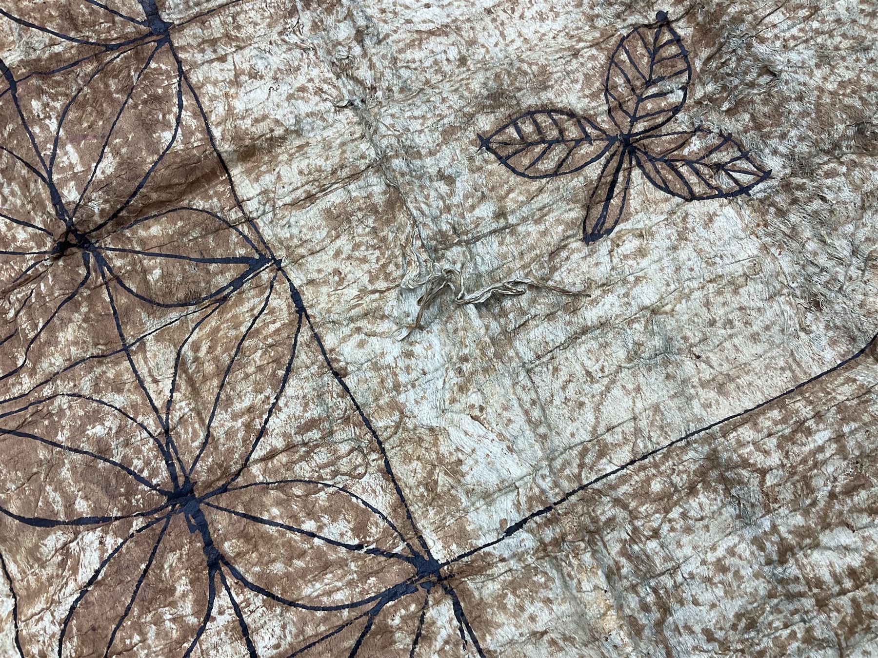 Collection of traditional necklaces from the Solomon Islands, including shell and boar tusk examples, together with a carved canoe prow, with mother of pearl eyes, painted cow hide and a copper plaque, depicting the Solomon Islands, with presentation engraving