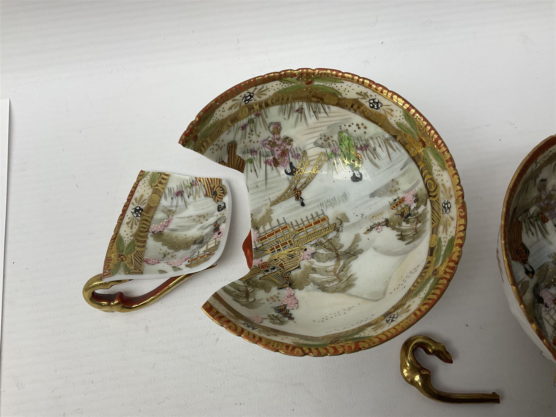 Noritake part tea service, printed and painted with figures in a landscape, comprising ten  tea cups and saucers, ten dessert plates, milk jug and sugar bowl