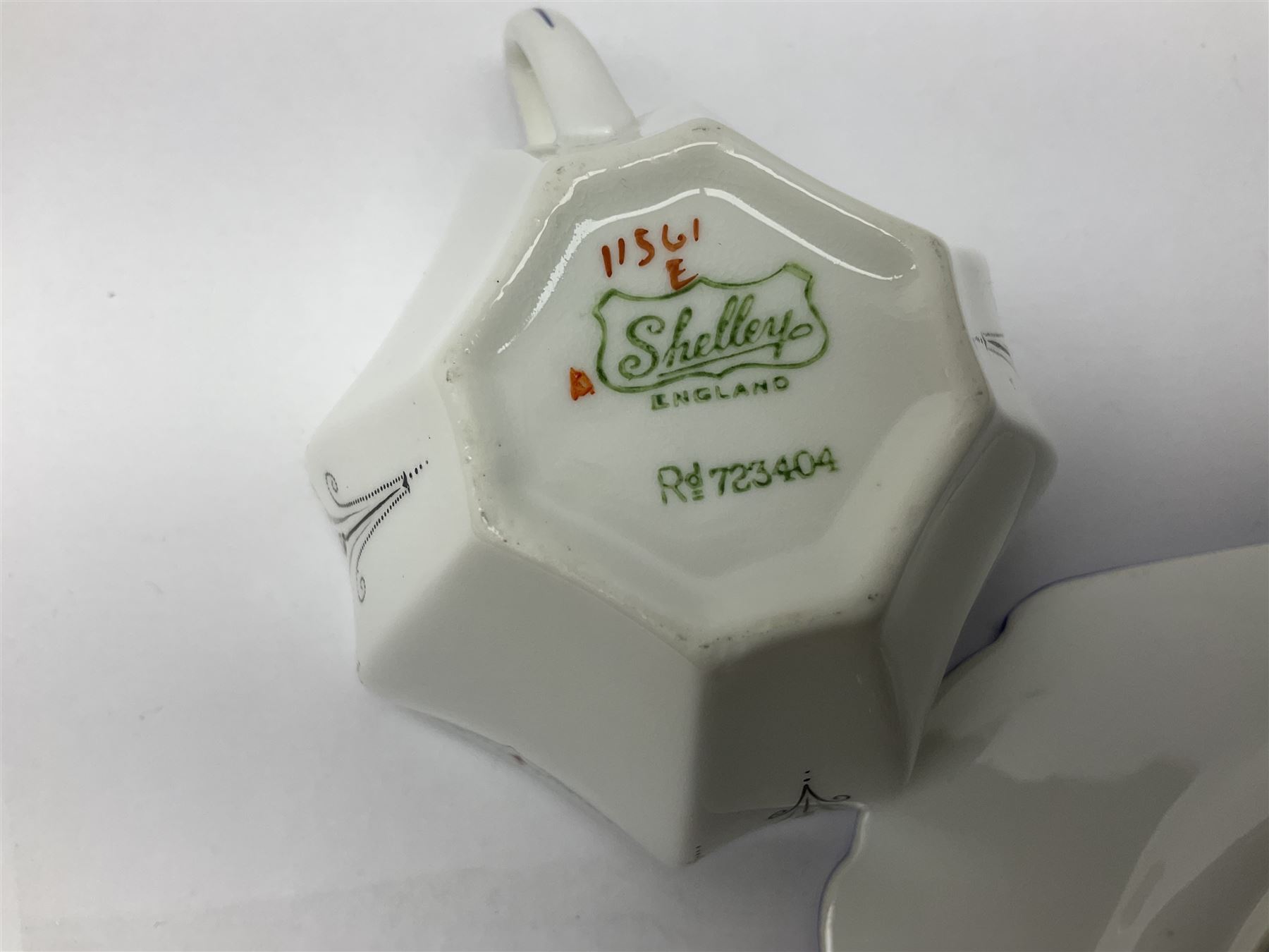 1920s Shelley Queen Anne shaped trio, decorated in the Blue Iris pattern no. 11561, ith printed mark beneath 