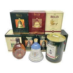 Dimple 15 Year Old Blended Scotch Whisky, together with nine Bells, scotch whisky, in Wade ceramic decanters, including Christmas 1991, 1998, 1996 etc, of various contents and proof 