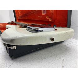1963 Fender Jazz three-knob bass guitar; impressed with date code 7AUG63A on end of neck and serial no.L08587 on back plate; all original but re-finished in white in the 1970s; sold with photographs of the instrument in the 1960s with original finish and in the 1970s re-finished; L117.5cm; in original hard carrying case; Provenance: the professional guitar of Howard Livett from new to his death in 2005. Howard played in The Humperdincks, the backing group for Englebert Humperdinck, also played in the backing group for Max Bygraves and in the band Hedgehoppers Anonymous. The guitar is also sold with a manuscript letter of provenance from Howard's wife.